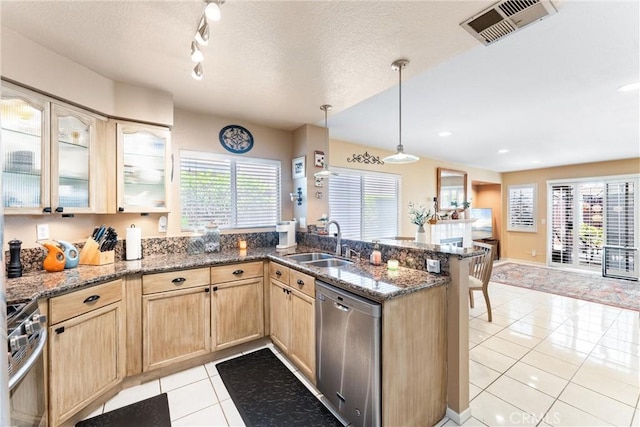 861 Shade Tree Way, Corona, CA 92878 - kitchen with stainless steel appliances, light brown cabinets, a peninsula, light tile patterned floors, and dark stone countertops
