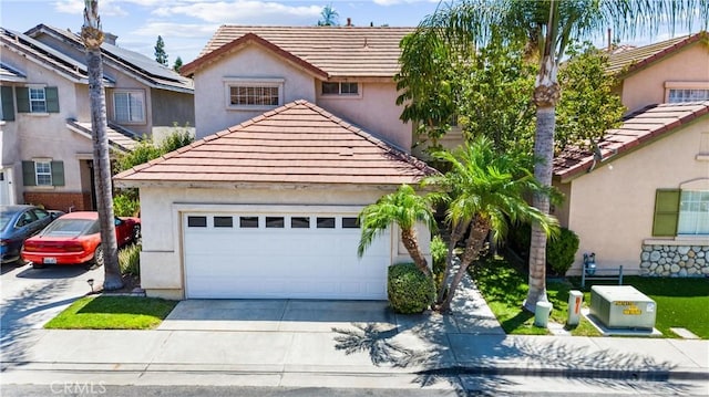 861 Shade Tree Way, Corona, CA 92878 - view of front of property featuring a tile roof, concrete driveway, stucco siding, and a garage