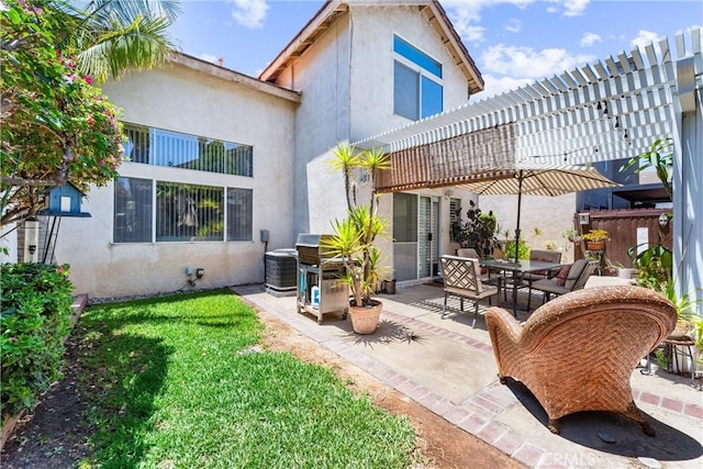 861 Shade Tree Way, Corona, CA 92878 - rear view of property featuring stucco siding, a patio area, and a lawn