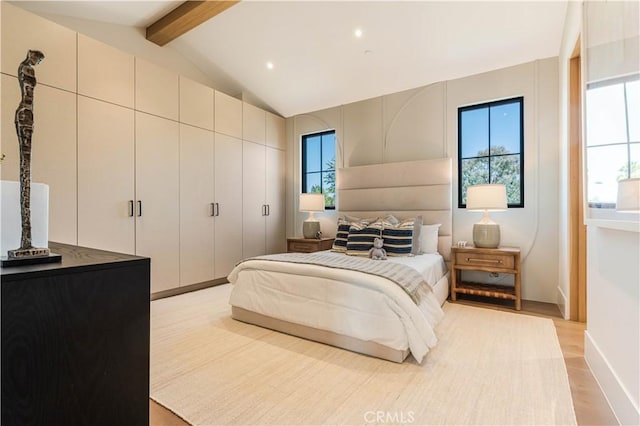 16711 Moorpark St, Encino, CA 91436 - bedroom with multiple windows, light wood-style floors, and a closet