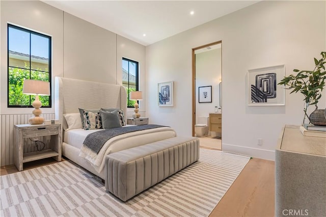 16711 Moorpark St, Encino, CA 91436 - bedroom with light wood finished floors and ensuite bath