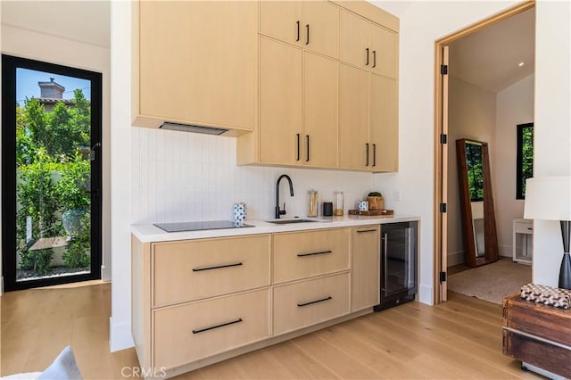16711 Moorpark St, Encino, CA 91436 - kitchen featuring beverage cooler, light countertops, and light brown cabinets