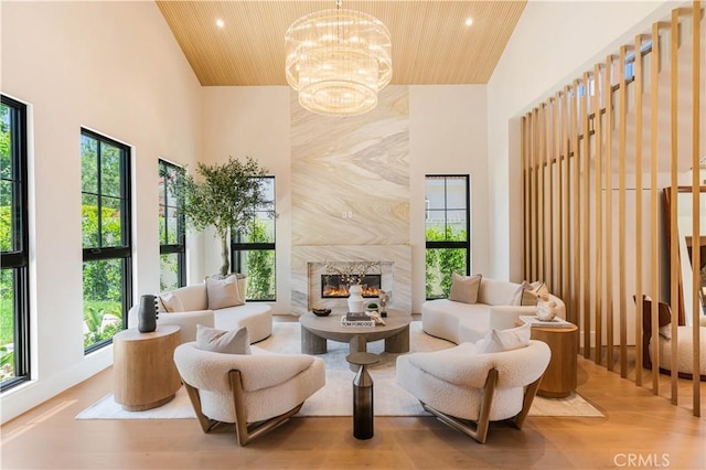 16711 Moorpark St, Encino, CA 91436 - sitting room featuring high vaulted ceiling, wood ceiling, wood finished floors, recessed lighting, and a premium fireplace