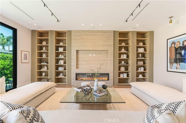 16711 Moorpark St, Encino, CA 91436 - living area with built in features, a large fireplace, and track lighting