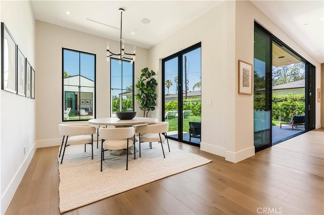 16711 Moorpark St, Encino, CA 91436 - dining area featuring wood-type flooring, a chandelier, and recessed lighting