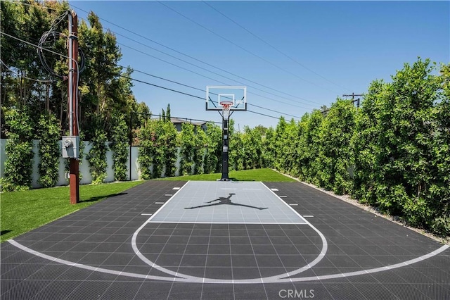 16711 Moorpark St, Encino, CA 91436 - view of basketball court featuring basketball hoop and a yard