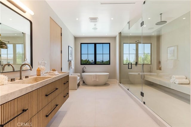 16711 Moorpark St, Encino, CA 91436 - bathroom with a stall shower, vanity, a freestanding bath, tile patterned floors, and recessed lighting