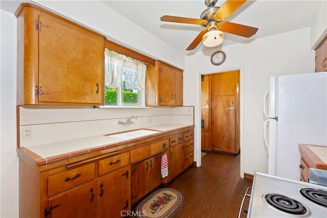 8356 Duarte Rd, San Gabriel, CA 91775 - kitchen with white appliances, tasteful backsplash, dark wood-style floors, and tile counters