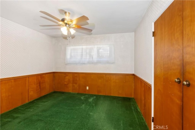 8356 Duarte Rd, San Gabriel, CA 91775 - spare room with wainscoting, carpet floors, wooden walls, ceiling fan, and wallpapered walls