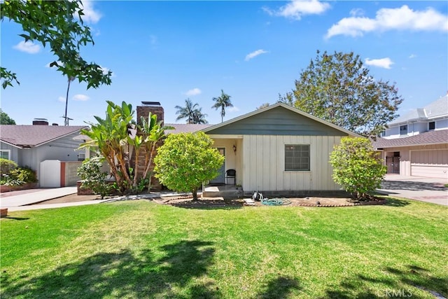 8356 Duarte Rd, San Gabriel, CA 91775 - ranch-style house with a front yard, a chimney, and board and batten siding
