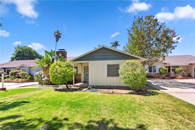 8356 Duarte Rd, San Gabriel, CA 91775 - ranch-style house with a chimney and a front yard