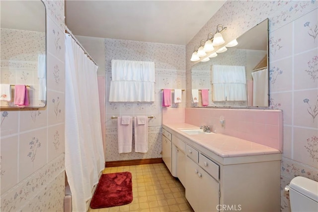 8356 Duarte Rd, San Gabriel, CA 91775 - bathroom featuring vanity, tile patterned floors, wallpapered walls, a shower with shower curtain, and tile walls