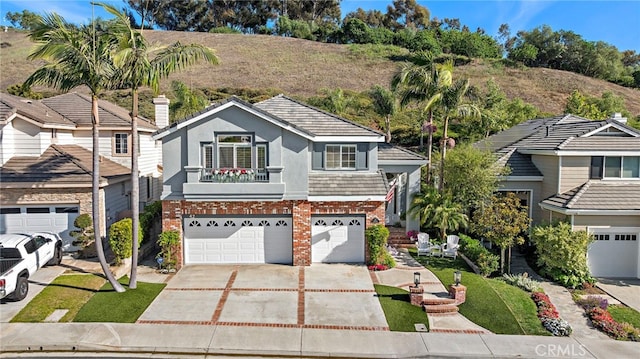 42 Fairlane Rd, Laguna Niguel, CA 92677 - traditional-style home with brick siding, stucco siding, concrete driveway, and an attached garage