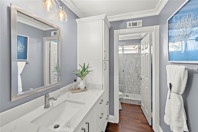 42 Fairlane Rd, Laguna Niguel, CA 92677 - bathroom featuring vanity, ornamental molding, a stall shower, and wood finished floors