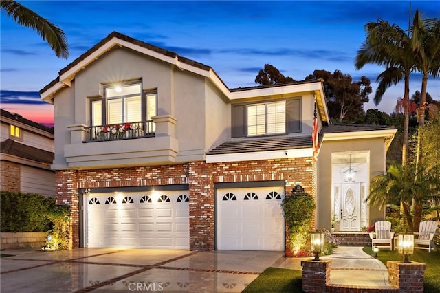42 Fairlane Rd, Laguna Niguel, CA 92677 - traditional-style home with stucco siding, an attached garage, and brick siding