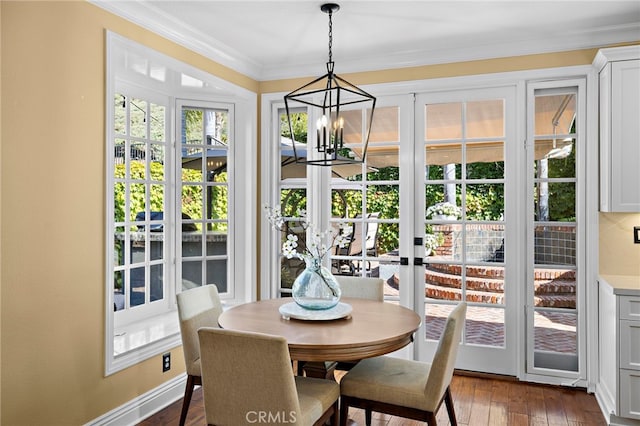 42 Fairlane Rd, Laguna Niguel, CA 92677 - dining room featuring a chandelier, ornamental molding, and dark wood finished floors