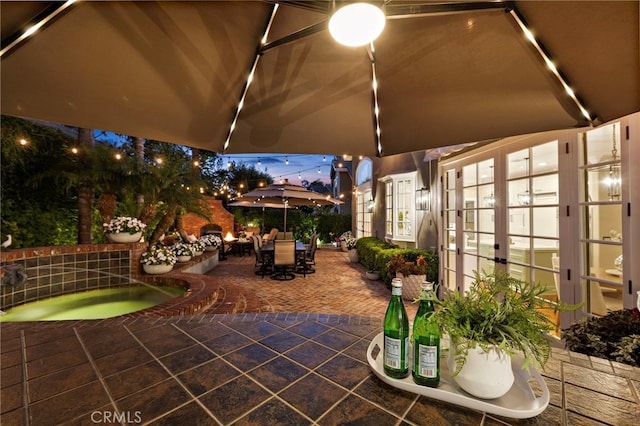 42 Fairlane Rd, Laguna Niguel, CA 92677 - view of patio / terrace with outdoor dining area, french doors, and an in-ground hot tub