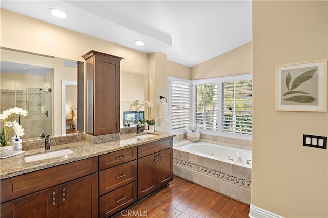 42 Fairlane Rd, Laguna Niguel, CA 92677 - full bath featuring a stall shower, double vanity, a tub with jets, wood finished floors, and lofted ceiling