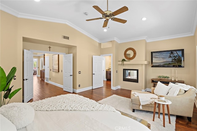 42 Fairlane Rd, Laguna Niguel, CA 92677 - bedroom featuring lofted ceiling, crown molding, dark wood finished floors, a glass covered fireplace, and recessed lighting