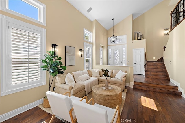 42 Fairlane Rd, Laguna Niguel, CA 92677 - living area featuring stairs, high vaulted ceiling, dark wood-type flooring, and a chandelier