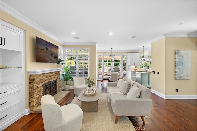 42 Fairlane Rd, Laguna Niguel, CA 92677 - living room featuring ornamental molding, dark wood-style floors, recessed lighting, and a stone fireplace