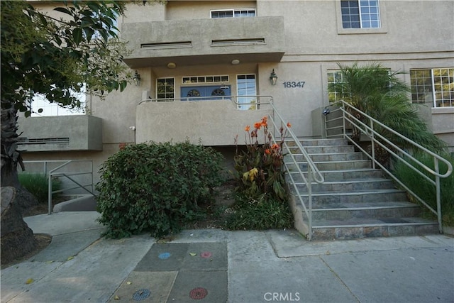 18347 Saticoy St Unit 33, Reseda, CA 91335 - property entrance featuring stucco siding