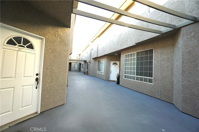 18347 Saticoy St Unit 33, Reseda, CA 91335 - view of exterior entry featuring stucco siding and a patio
