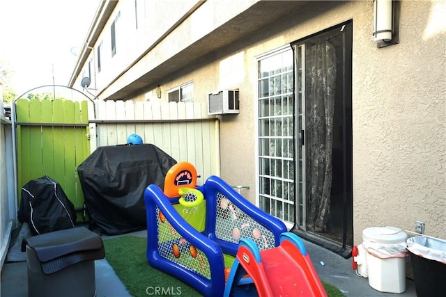 18347 Saticoy St Unit 33, Reseda, CA 91335 - view of patio featuring grilling area and a wall mounted AC