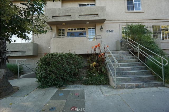 18347 Saticoy St Unit 33, Reseda, CA 91335 - doorway to property featuring stucco siding