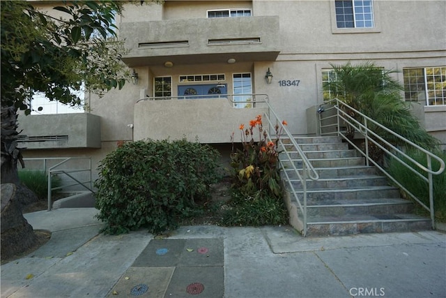 18347 Saticoy St Unit 33, Reseda, CA 91335 - view of exterior entry featuring stucco siding