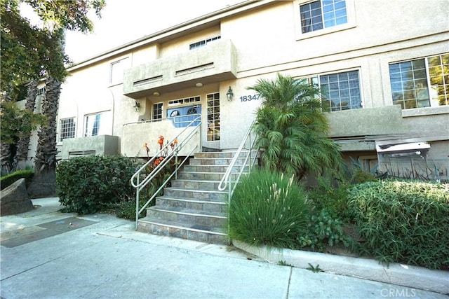 18347 Saticoy St Unit 33, Reseda, CA 91335 - property entrance featuring stucco siding