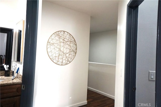 18347 Saticoy St Unit 33, Reseda, CA 91335 - hallway featuring dark wood-type flooring and baseboards