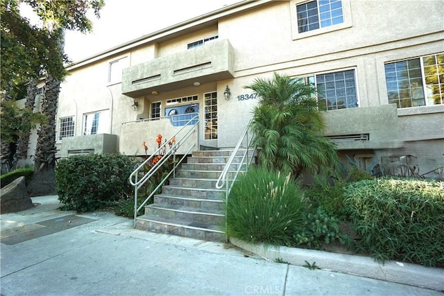 18347 Saticoy St Unit 33, Reseda, CA 91335 - property entrance featuring stucco siding
