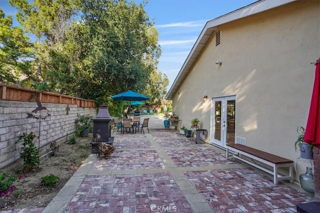 10624 Nevada Ave, Chatsworth, CA 91311 - view of patio featuring french doors and outdoor dining area