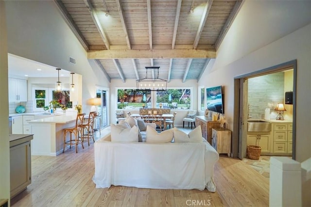 10624 Nevada Ave, Chatsworth, CA 91311 - living room featuring wooden ceiling, light wood-style flooring, and plenty of natural light