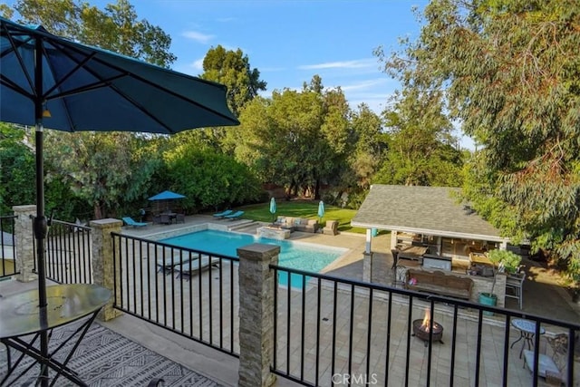 10624 Nevada Ave, Chatsworth, CA 91311 - swimming pool featuring a fire pit, a patio, an outdoor structure, and a storage structure