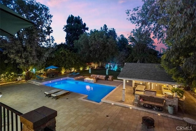 10624 Nevada Ave, Chatsworth, CA 91311 - swimming pool featuring a patio, an outbuilding, and an exterior structure