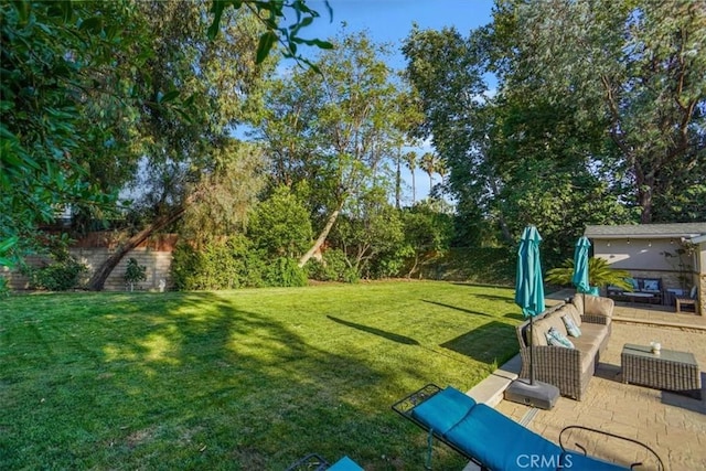 10624 Nevada Ave, Chatsworth, CA 91311 - view of green lawn with a patio area and an outdoor hangout area