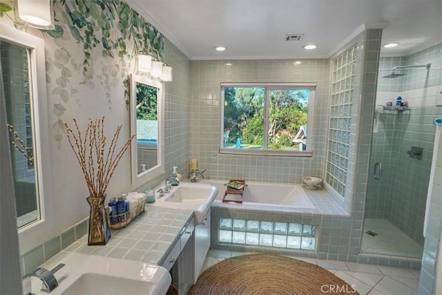 10624 Nevada Ave, Chatsworth, CA 91311 - bathroom with a shower stall, a bath, tile patterned floors, double vanity, and tile walls