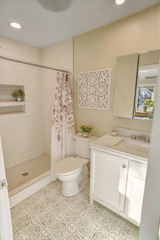 10624 Nevada Ave, Chatsworth, CA 91311 - full bath featuring a shower stall, vanity, tile patterned flooring, and recessed lighting