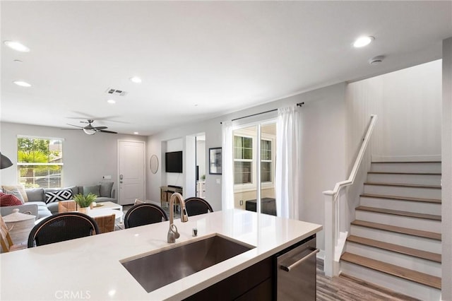 5 Zacate St, Rancho Mission Viejo, CA 92694 - kitchen featuring open floor plan, stainless steel dishwasher, light countertops, light wood-style floors, and recessed lighting