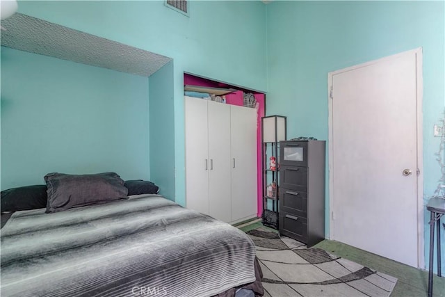 13572 Sutter Dr, Westminster, CA 92683 - bedroom featuring carpet floors, a towering ceiling, and a closet