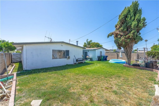13572 Sutter Dr, Westminster, CA 92683 - rear view of house featuring a fenced backyard and stucco siding