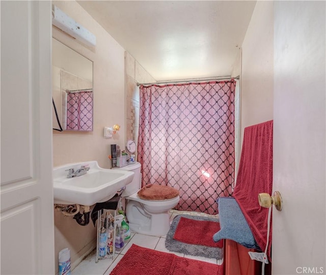 13572 Sutter Dr, Westminster, CA 92683 - bathroom with tile patterned floors and a shower with curtain