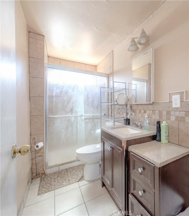 13572 Sutter Dr, Westminster, CA 92683 - full bathroom featuring vanity, a shower stall, tile patterned floors, and backsplash