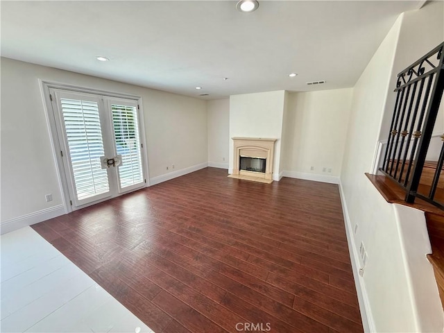 11737 Lois Ct, Granada Hills, CA 91344 - unfurnished living room featuring dark wood finished floors, recessed lighting, a fireplace with flush hearth, and french doors