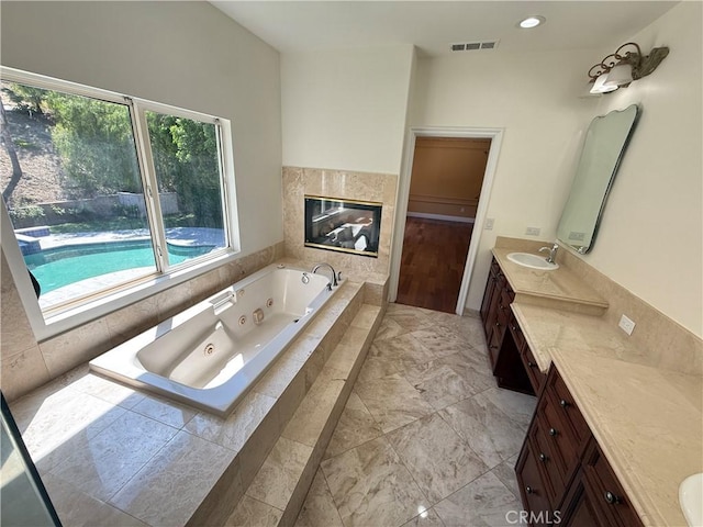 11737 Lois Ct, Granada Hills, CA 91344 - full bathroom featuring vanity and a whirlpool tub