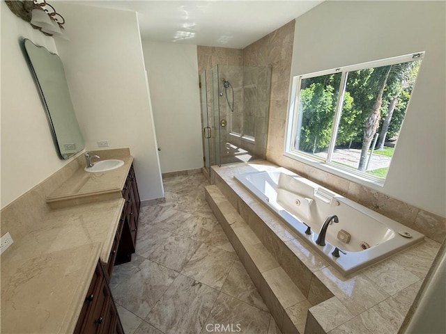 11737 Lois Ct, Granada Hills, CA 91344 - bathroom featuring vanity, a stall shower, a whirlpool tub, and marble finish flooring