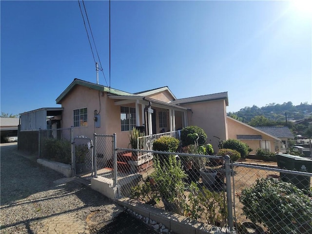 6162 Annan Way, Los Angeles, CA 90042 - view of front of house with stucco siding, a gate, and a fenced front yard