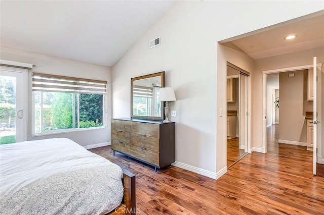 2580 Crown Way, Fullerton, CA 92833 - bedroom with multiple windows, wood finished floors, vaulted ceiling, and recessed lighting